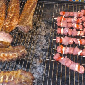 Italy Street Food. Grilled Sausages, Roasted Pigs, Ribs, Skewers and more Meat on Fire