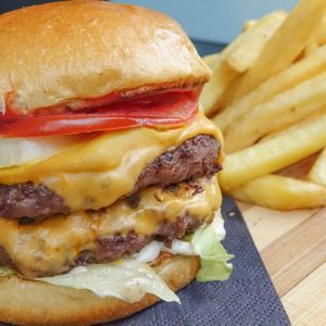 Double Burger, Bacon and Cheese. Street Food in re-opening London