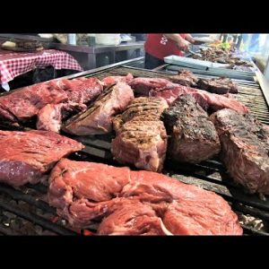 Giant 'Fiorentina' Steaks. Cutting and Grilling Huge Blocks of Beef Meat. Italy Street Food