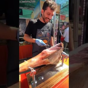 Cutting by Hand Italian Prosciutto Ham