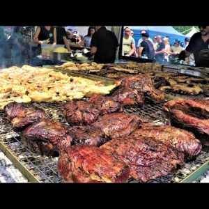 Argentina Street Food. Grilling Huge Blocks of Angus Meat. Biker Fest, Lignano, Italy