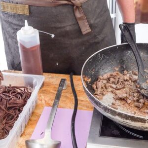 Chocolate Spaghetti with Wild Boar Ragout, Italy Street Food. Chocolate Festival